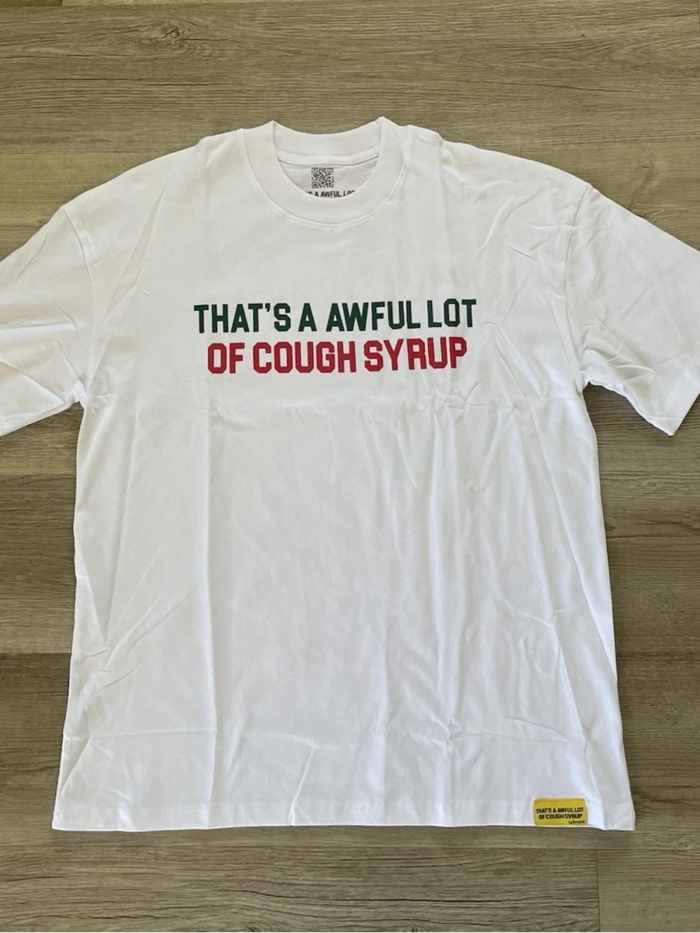 White Graphic Short-Sleeve Tee with Bold Green & Red Text